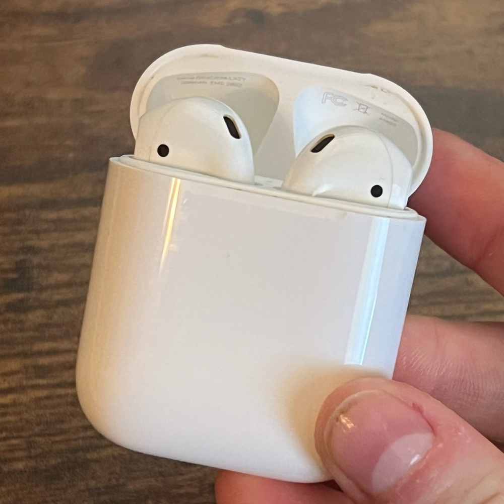 First Generation AirPods and two cases